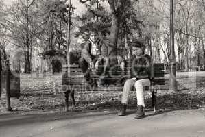 Teenage girl and boy on bench