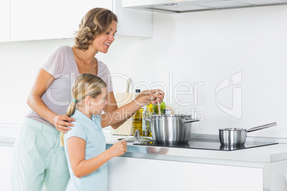 Mother and daughter preparing dinner