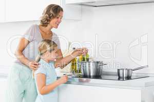 Mother and daughter preparing dinner