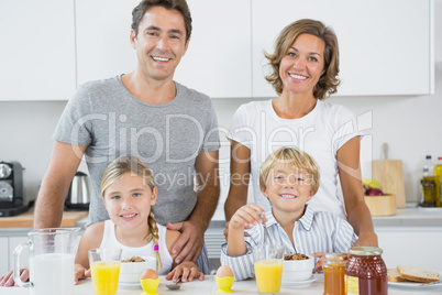 Happy family at breakfast