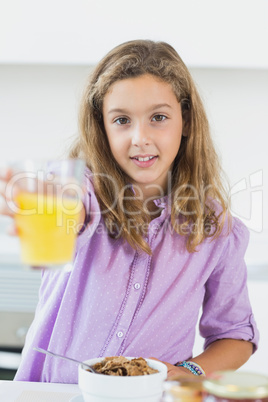 Girl offering orange juice