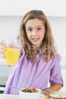 Girl offering orange juice