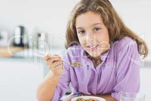 Little girl having cereal