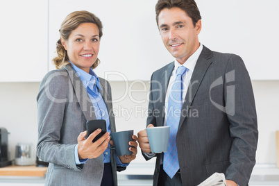 Power couple having coffee before work