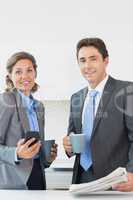 Business couple having coffee before work