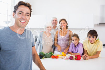 Father standing by kitchen counter