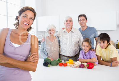 Mother standing by kitchen counter