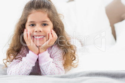 Cute girl lying on bed