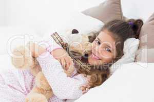 Little girl and her teddy bear