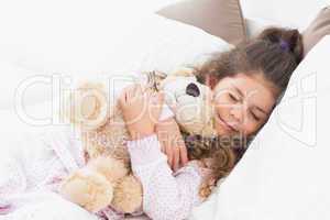 Little girl asleep with her teddy bear