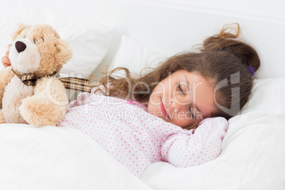 Cute girl asleep with teddy bear