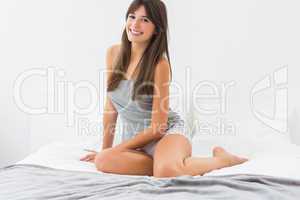 Smiling woman on bed