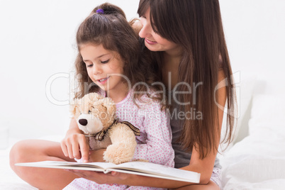 Mother and daughter reading a storybook