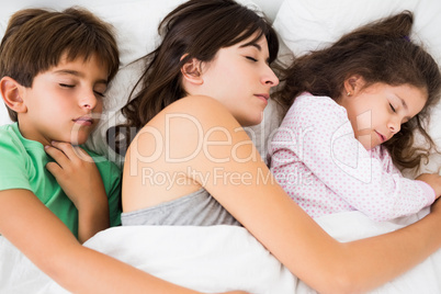Mother and children asleep