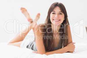 Woman relaxing in bed