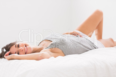 Pretty woman lying in bed