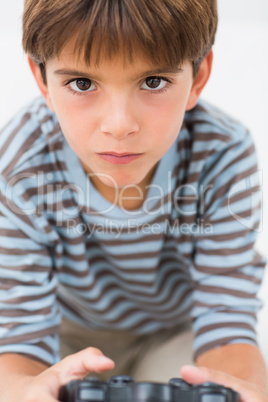 Little boy playing games console