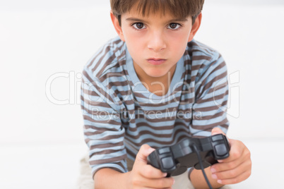 Boy playing his game console