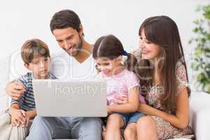 Family using laptop together