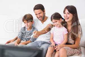 Happy family watching television