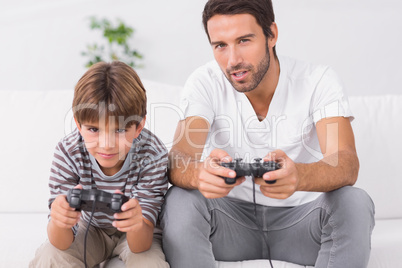 Father and son playing video games