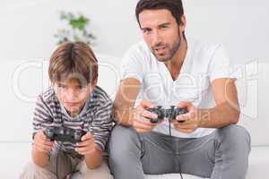 Father and son playing video games