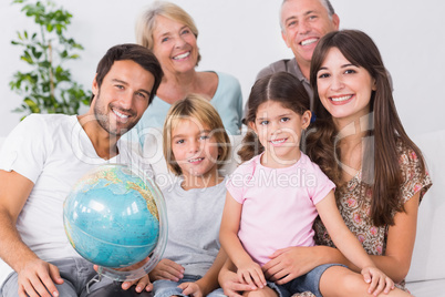 Smiling family with globe