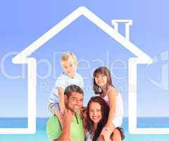Family posing with a house illustration and the sea