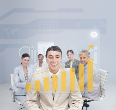 Digital screen showing the yellow graph and a business team
