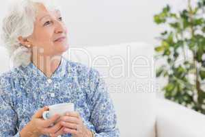 Elderly smiling woman looking away