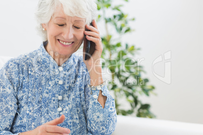 Elderly happy woman calling someone