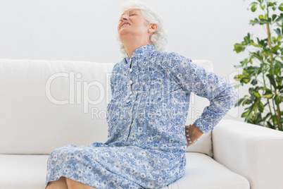 Elderly woman feeling back pain