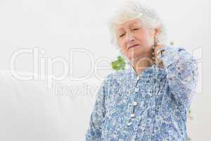 Elderly woman having a neck pain
