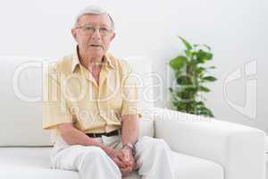 Elderly man looking at camera