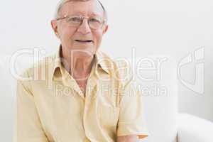 Cheerful elderly man looking at camera