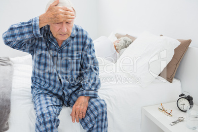 Elderly man suffering with head pain