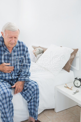 Old man suffering with belly pain