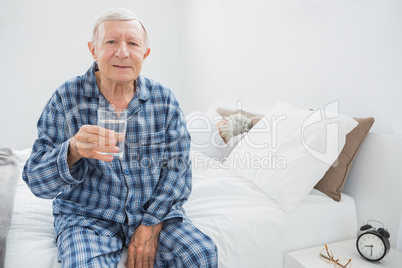 Old man with a water glass