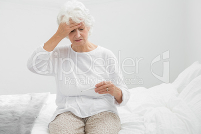 Aged woman suffering with fever