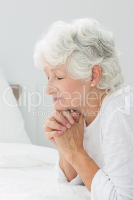 Aged woman praying