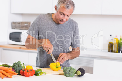 Man cutting pepper Man cutting pepper