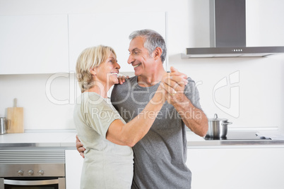 Smiling couple dancing together