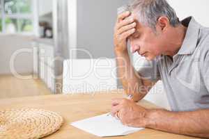 Focused man reading documents