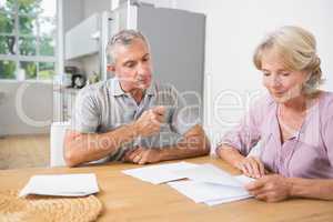 Couple reading documents together