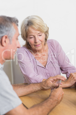 Husband and wife playing cards