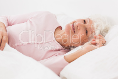 Happy woman in bed