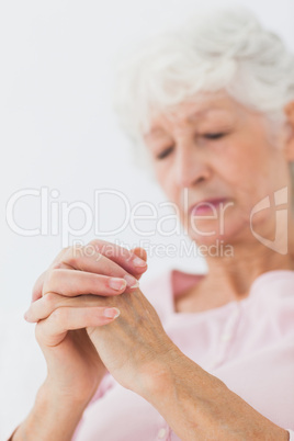 Woman praying in bed