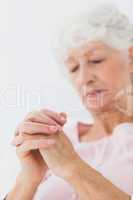 Woman praying in bed