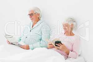 Couple reading in bed