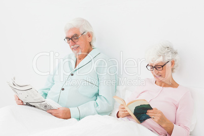 Couple reading in bed